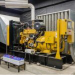 Image of large industrial yellow gas engine in a warehouse