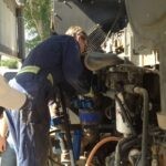 An image of John Vronay Field working on installing a Continental control corporation Fuel control Valve