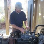 Image of Mike Young installing a Continental Controls Corporation Electronic gas carburetor EGC4