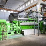 Image of a green gas engine in a facility building